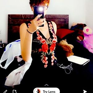 Black tight dress with flowers on the front